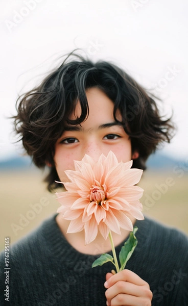 Fototapeta Japanese boy holding a dahlia to his mouth generated by AI