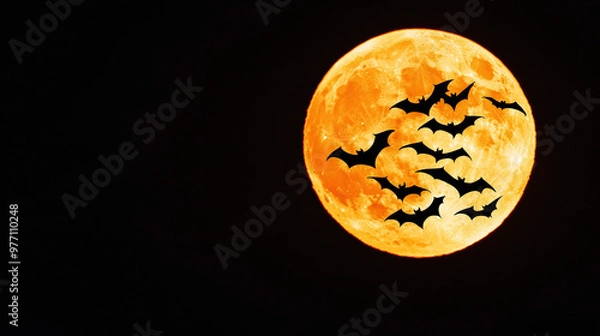 Fototapeta a colony of bats in flight, silhouetted against a full moon