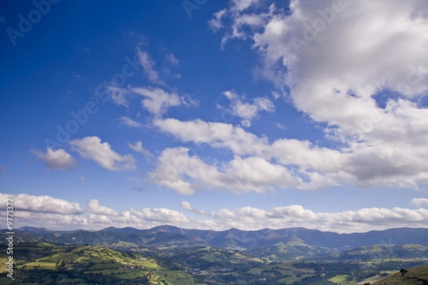 Fototapeta Rural landscape with cloudy sky in North of Spain