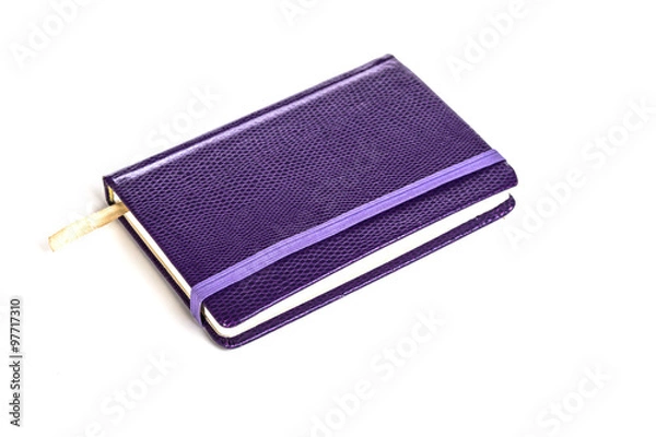Obraz purple notebook on a white background
