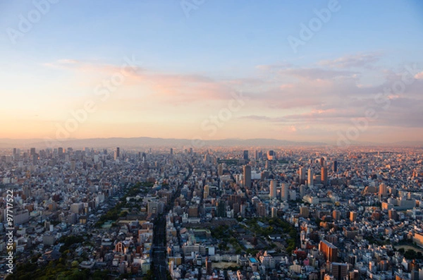 Obraz 夕日に照らされる大阪