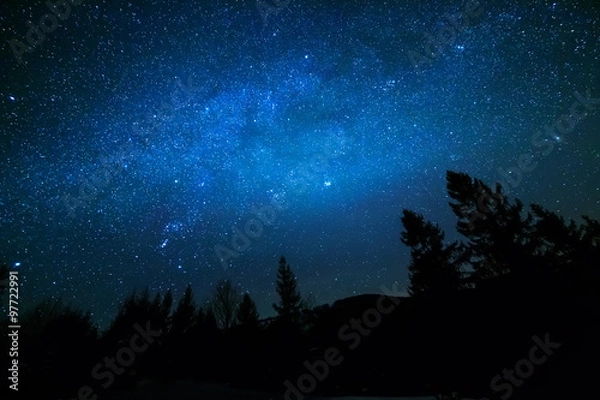 Obraz Milky Way in sky full of stars. Winter mountain landscape in night.
