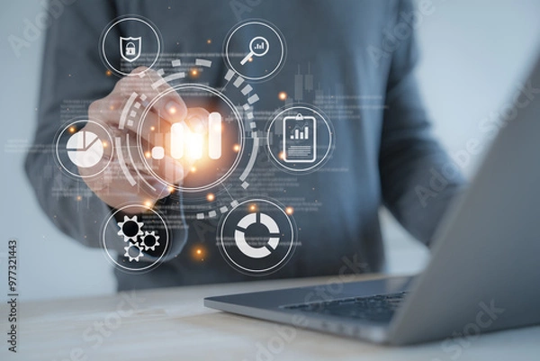 Fototapeta businessman on document planning the business plans and analyse  profitability of working companies with digital augmented virtual graphics for project manager working on laptop and update information