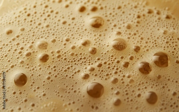 Fototapeta Close-up of golden bubbles, creating a textured surface.