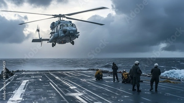 Fototapeta Naval helicopter taking off from warship deck during Navy Day operations with sailors assisting on board