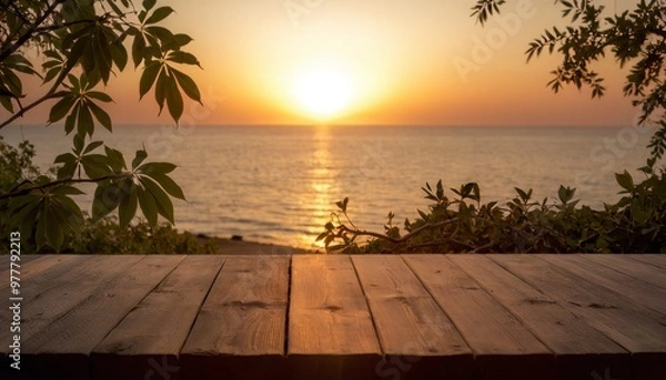 Fototapeta Photo of a wooden table with a view of the ocean and sunset