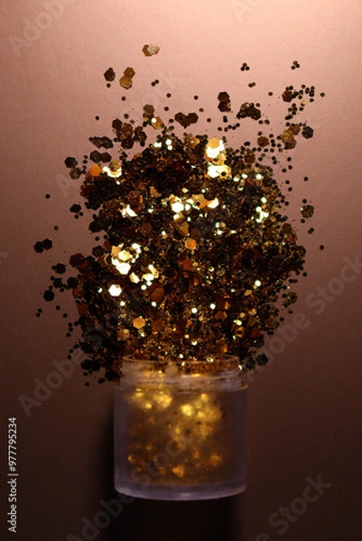 Obraz golden shiny glitter on a light brown background