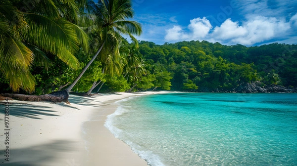 Fototapeta A lush tropical beach with turquoise waters and white sand palm trees swaying in the breeze.