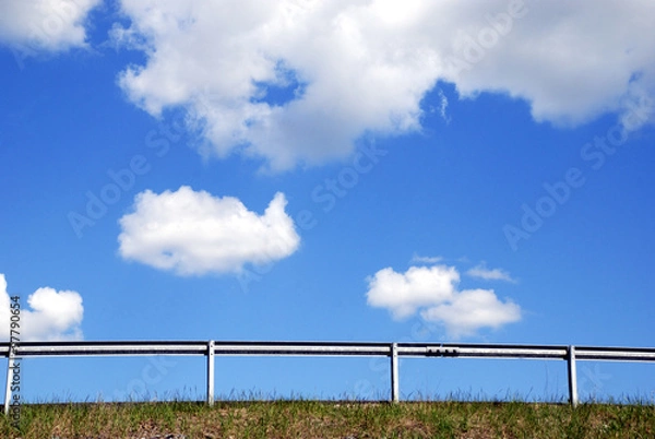 Fototapeta Summer sky with clouds and fence 2