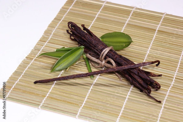 Obraz vanilla beans with leaf on bamboo background