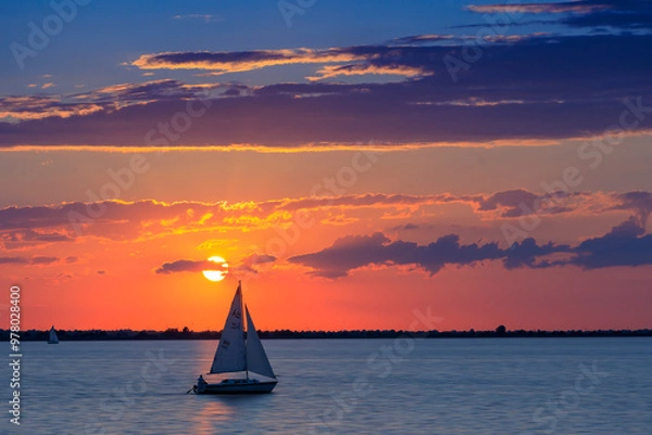 Obraz Summer Sunset on Lake Hefner in Oklahoma City, OK, USA, with a sailboat