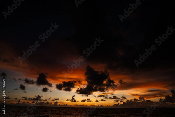 Fototapeta Beautiful clouds and colors of a sunset
