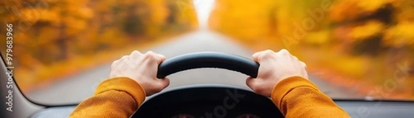 Fototapeta A driver following a scenic route through autumn foliage, the colorful leaves creating a vibrant backdrop, fall road trip driver, seasonal scenic driving