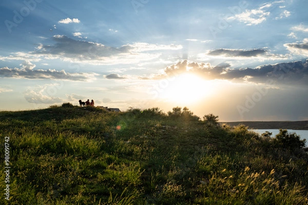 Obraz a couple watching the sunset