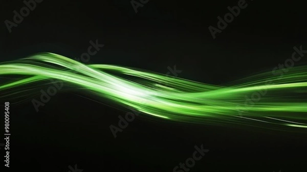 Fototapeta A streak of green light leaving a glowing trail across a black background, adding motion and energy.