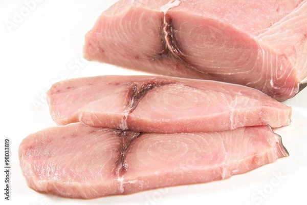Fototapeta Sliced fillet of swordfish, white background.