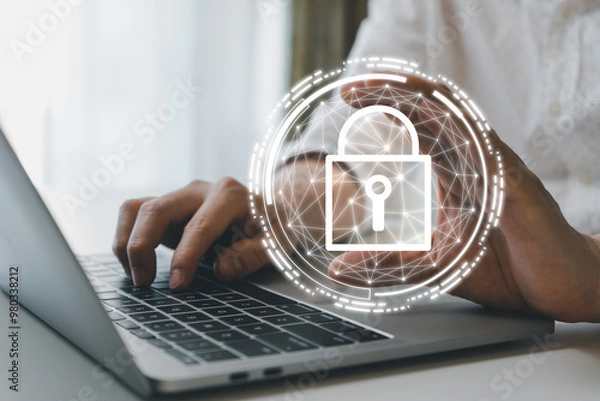 Fototapeta Business man holding virtual padlock icon and using laptop computer to secure personal information network login. Cyber security encryption and digital privacy protection concept.