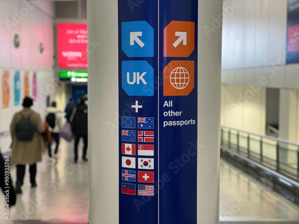 Fototapeta Passport Control and UK Border signage in the public area at Heathrow Airport London England