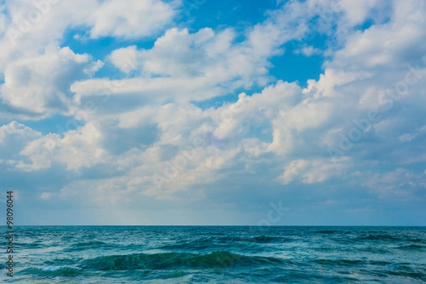 Fototapeta Sea background with cloudy sky.