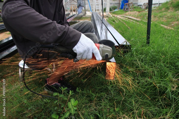 Obraz Workers are using steel cutting tools