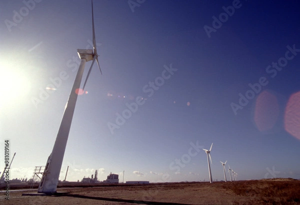 Fototapeta Wind Turbines Against a Bright Sky