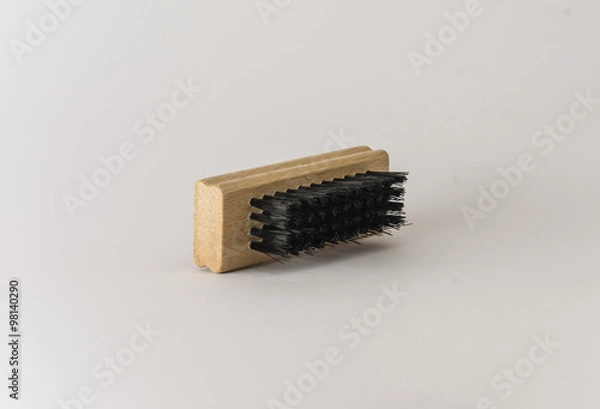 Fototapeta Brush for boots. Cleaning tool. Close up. Isolated on white background.
