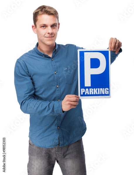 Fototapeta young man showing a parking sign