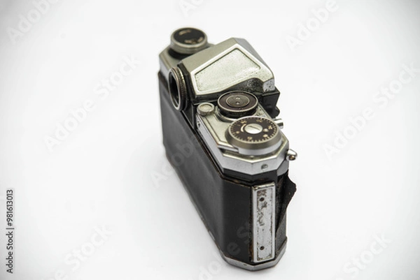 Fototapeta Poorly treated photo camera destroyed by time damaged broken