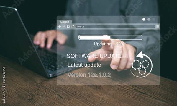 Fototapeta Software update concept. Man updating and Installing business program updates on computer for better performance, security and new features