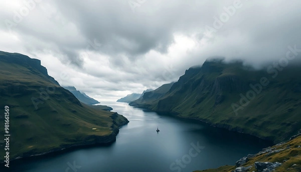 Fototapeta A landscape view of the Eidhisflogvi Fjord on the Faroe island during a stormy day