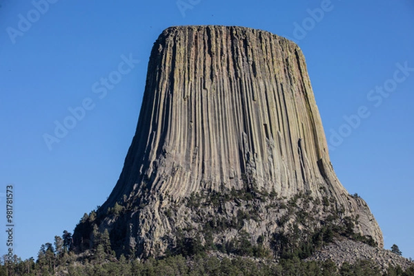 Obraz Image of national monument the Devils Tower in Wyoming against a bright blue sky.