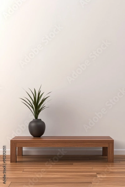 Fototapeta A minimalist wooden bench with a potted plant against a plain wall in a serene indoor setting