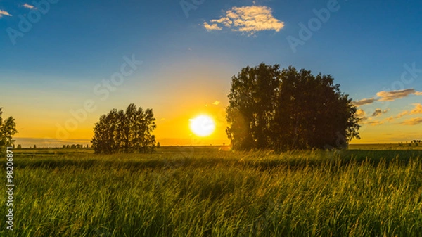 Fototapeta Закат солнца в полях Сибири, Россия