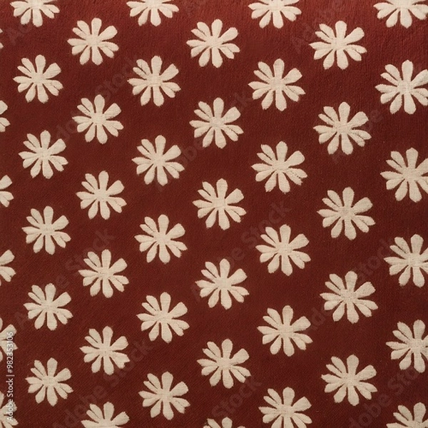 Fototapeta close-up view of a patterned fabric. The fabric features a repetitive design of small, circular shapes with a central dot, resembling flowers or starbursts