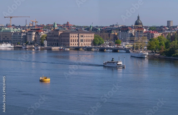 Obraz Panorama view, the bay Strömmen with moored commuting boats, steam commuter ferry leaving, a sunny summer day in Stockholm