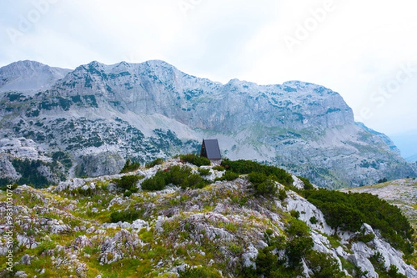 Fototapeta Beautiful a-frame mountain house shelter in the wilderness on the mountain