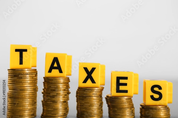 Obraz Alphabet TAXES and golden coins on table