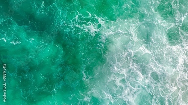 Fototapeta  An aerial perspective of a body of water featuring a wave advancing from both directions