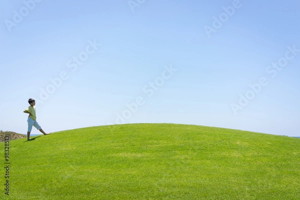 Obraz Kid jumping on beautiful field