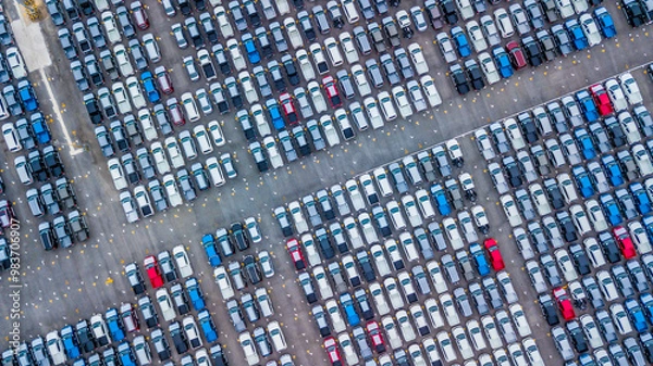 Fototapeta Aerial view new cars lined up in the port for import and export, Top view of new cars lined up automobile factory global logistic import export, New cars logistic to dealership for sale.