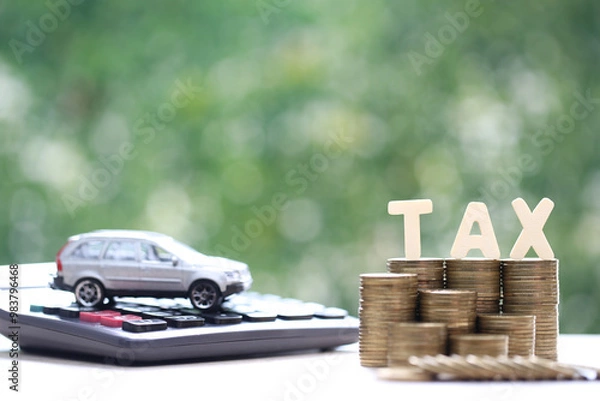 Obraz Car tax concept, Stack of coins money with tax wooden text and miniature car model on natural green background, Saving money for car, Finance and car loan