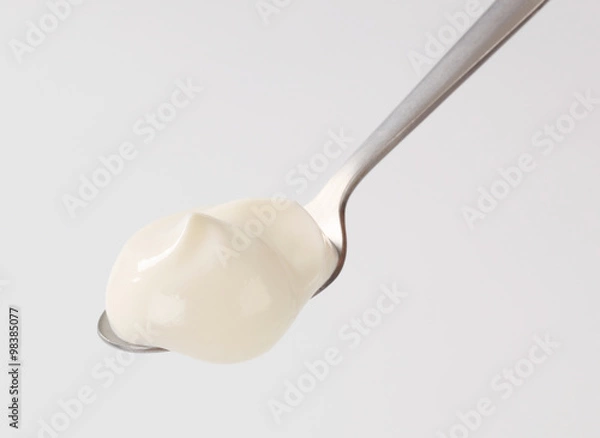 Obraz White yogurt on a spoon