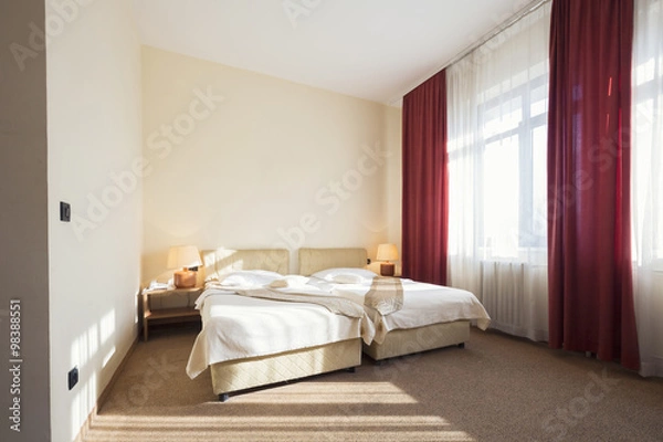 Fototapeta Hotel room interior with two beds