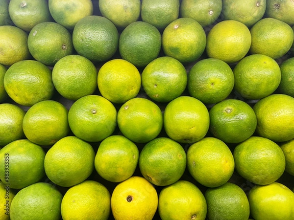 Fototapeta Fresh Orange Citrus fruit top view Background. Bunch of citrus fruits, Summer tray market agriculture farm full of organic fruits It can be used as background