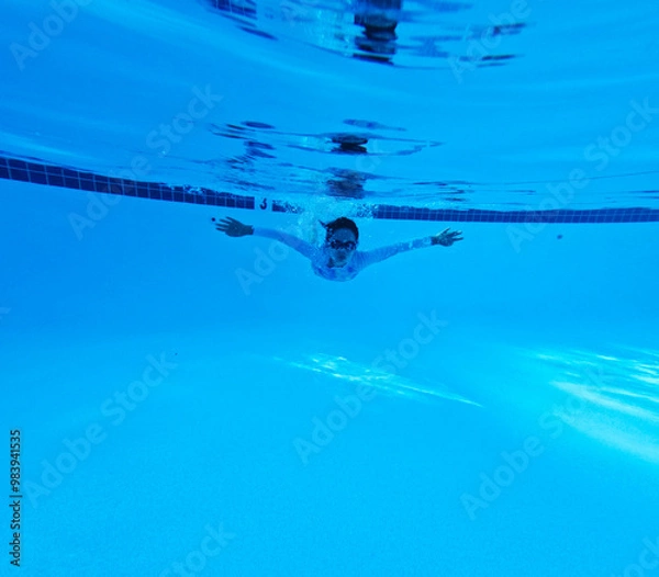 Obraz Kid Practicing Swimming in the Pool 