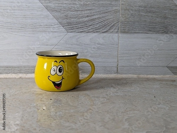 Obraz yellow smile cup isolated on white background