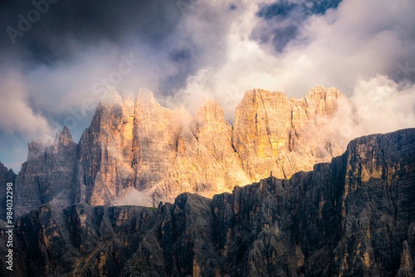 Fototapeta Detailed landscape view of colorful mountain range with dramatic light, Dolomites