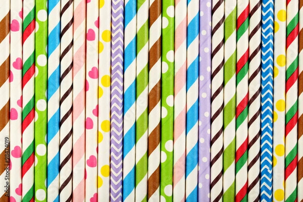 Obraz Striped drink straws background, close up