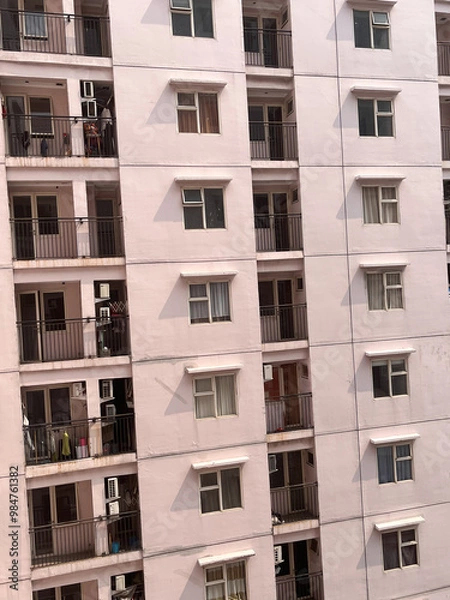 Fototapeta Jakarta, Indonesia - September 19 2024: apartment building with a very high front or side view