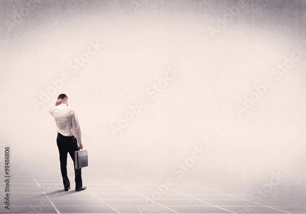 Fototapeta Business person standing in empty space